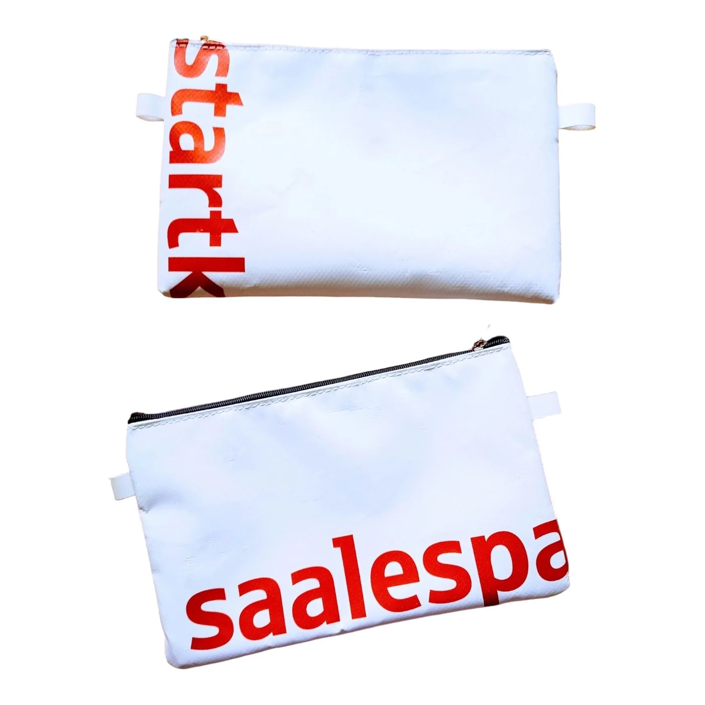 Simple flat mini zip pouches made from repurposed signage material