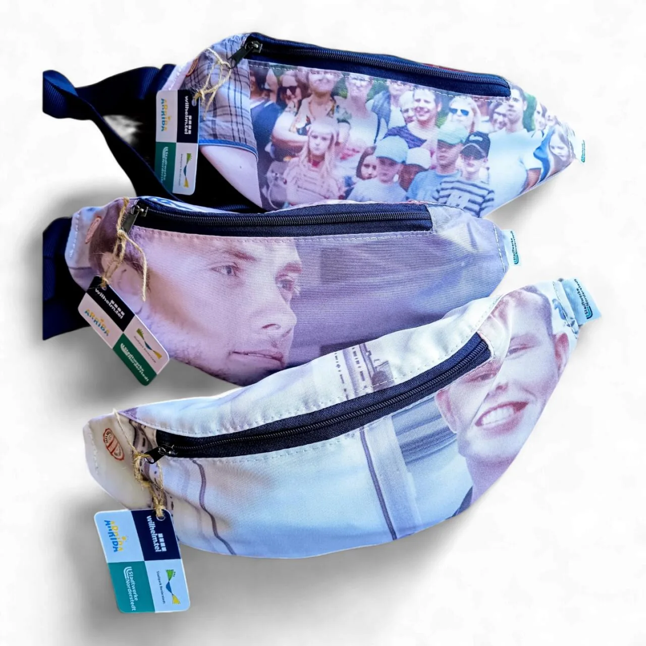 Three belt bags sewn from printed promotional banners