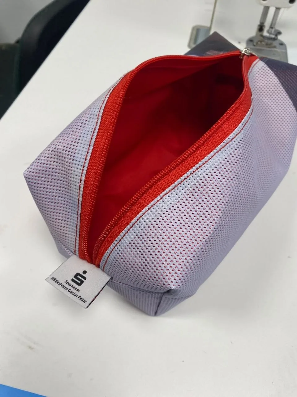 Close-up of flexible perforated banner mesh in a sewn pouch